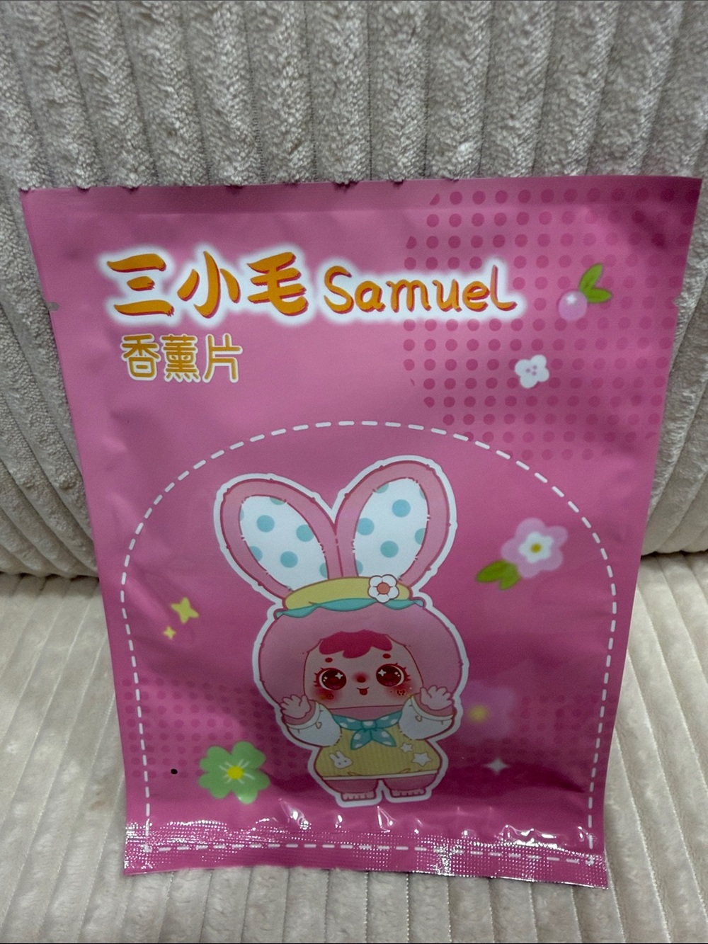 Samuel Scented Air Freshener. New in sealed bag. Cardboard material.